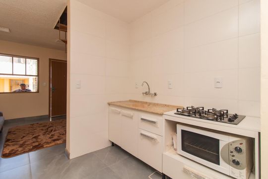 Cozinha e Área de Serviço de casa de condomínio à venda com 2 quartos, 65m² em Cavalhada, Porto Alegre