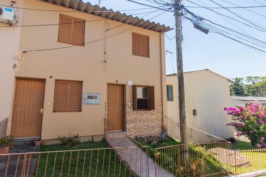 Fachada de casa de condomínio à venda com 2 quartos, 65m² em Cavalhada, Porto Alegre