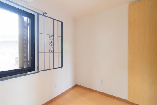 Quarto 2 de casa de condomínio para alugar com 3 quartos, 60m² em Vila Nova, Porto Alegre
