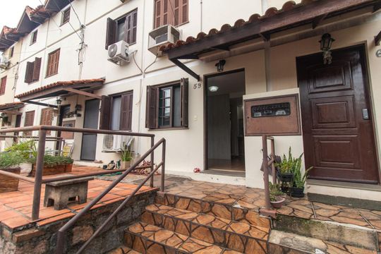 Fachada de casa de condomínio para alugar com 3 quartos, 60m² em Vila Nova, Porto Alegre