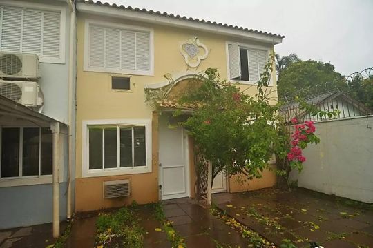 Fachada de casa de condomínio à venda com 2 quartos, 79m² em Rio Branco, Canoas