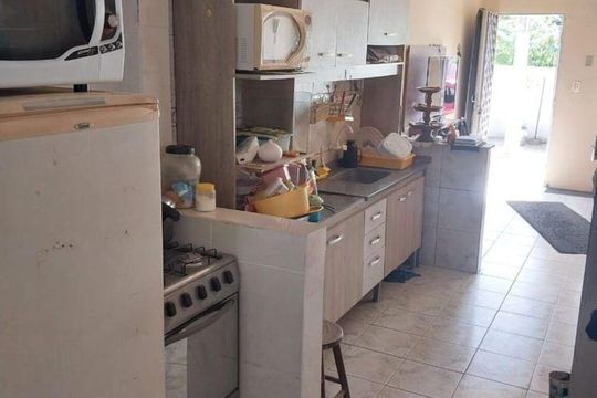 Cozinha  de casa de condomínio à venda com 2 quartos, 60m² em Costa E Silva, Porto Alegre