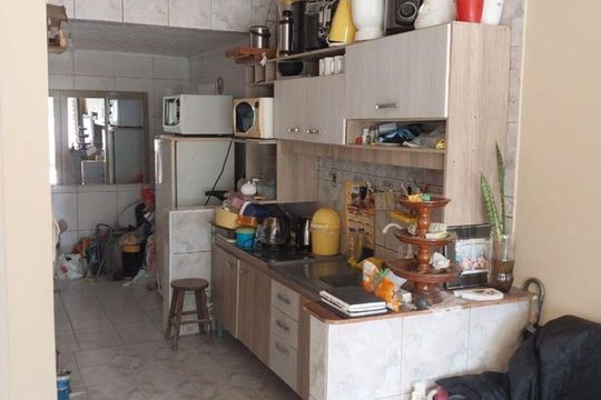 Cozinha  de casa de condomínio à venda com 2 quartos, 60m² em Costa E Silva, Porto Alegre