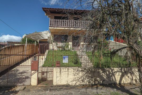 Fachada de casa à venda com 3 quartos, 200m² em Jardim Sabará, Porto Alegre