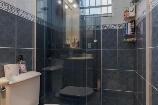 Banheiro de casa de condomínio à venda com 3 quartos, 260m² em Boa Vista, Porto Alegre