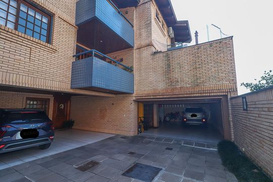 Fachada de casa de condomínio à venda com 5 quartos, 306m² em Boa Vista, Porto Alegre