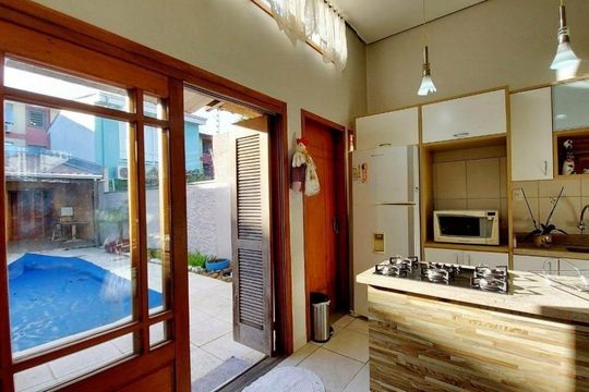 Sala / Cozinha  de casa de condomínio à venda com 4 quartos, 200m² em Partenon, Porto Alegre