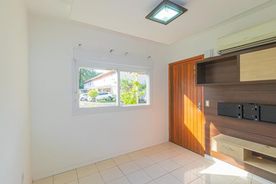 Sala de casa de condomínio à venda com 3 quartos, 122m² em Fátima, Canoas