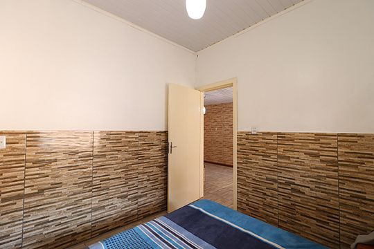 Quarto 1 de casa à venda com 2 quartos, 90m² em Costa E Silva, Porto Alegre