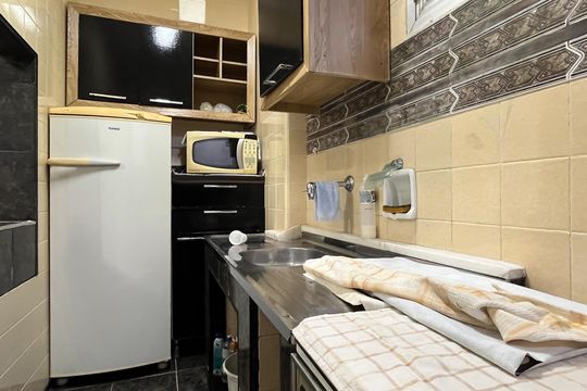 Cozinha e Área de Serviço de kitnet/studio para alugar com 1 quarto, 35m² em Embaré, Santos