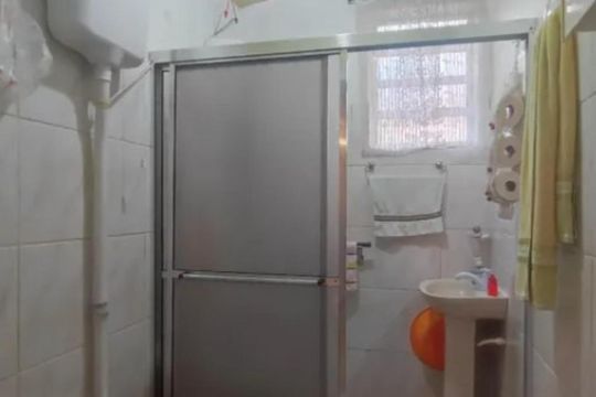 Banheiro 1 de casa à venda com 4 quartos, 127m² em Menino Deus, Porto Alegre