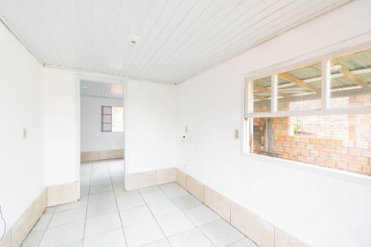 Sala/cozinha de casa de condomínio à venda com 1 quarto, 30m² em Niterói, Canoas