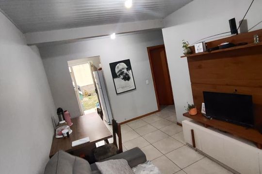 Sala de casa de condomínio para alugar com 2 quartos, 48m² em Formoza, Alvorada