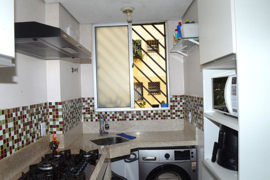 Cozinha e Área de Serviço de apartamento à venda com 2 quartos, 51m² em Pousada Santo Antonio, Belo Horizonte