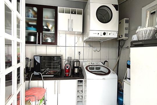 Área de serviço de casa de condomínio à venda com 3 quartos, 162m² em Guarujá, Porto Alegre