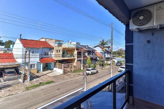 Varanda de casa à venda com 3 quartos, 133m² em Hípica, Porto Alegre