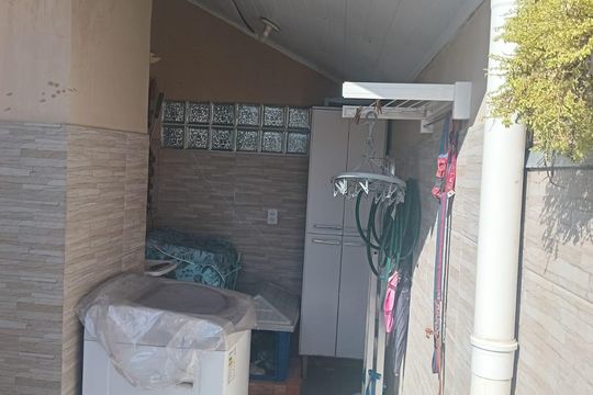 Área de serviço de casa de condomínio à venda com 2 quartos, 96m² em Vila Nova, Porto Alegre