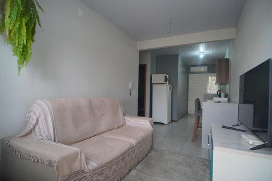 Sala de casa de condomínio à venda com 2 quartos, 48m² em Feitoria, São Leopoldo