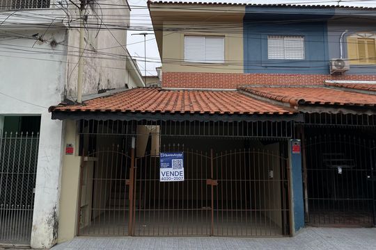 Fachada+Placa  de casa à venda com 2 quartos, 81m² em Parque Cruzeiro do Sul, São Paulo