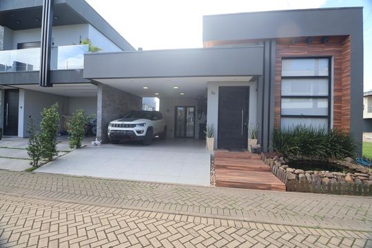 Fachada de casa de condomínio à venda com 3 quartos, 138m² em Fátima, Canoas