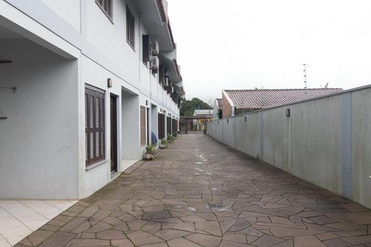 Área comum de casa de condomínio à venda com 3 quartos, 115m² em Vila Nova, Porto Alegre