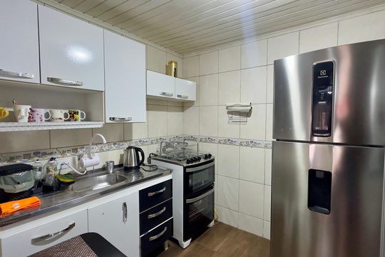 Cozinha 2 de casa à venda com 3 quartos, 180m² em Uberaba, Curitiba