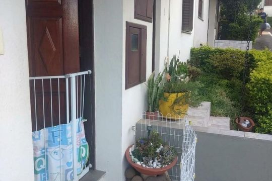 Área externa de casa de condomínio à venda com 3 quartos, 79m² em Vila Nova, Porto Alegre