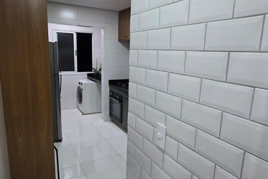 Área de serviço de apartamento para alugar com 2 quartos, 57m² em Parque Ipe, São Paulo