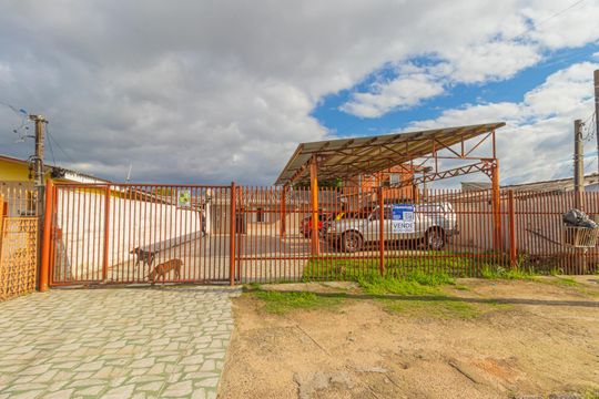 Fachada de casa à venda com 3 quartos, 98m² em Harmonia, Canoas