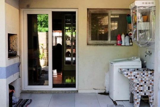 Área de serviço de casa à venda com 3 quartos, 112m² em Guarujá, Porto Alegre
