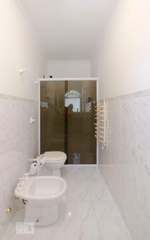 Casa à venda com 577m², 5 quartos e 7 vagasBanheiro Suíte 2