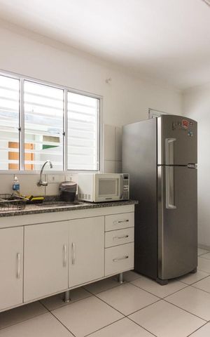 Casa à venda com 85m², 3 quartos e 2 vagas Casa à venda com 85m², 3 quartos e 2 vagasCozinha