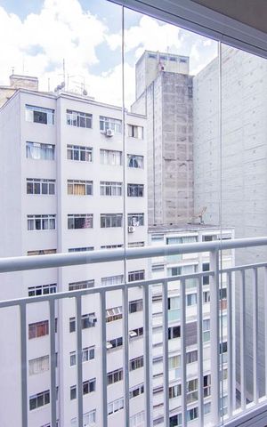 Studio à venda com 44m², 1 quarto e 1 vaga Studio à venda com 44m², 1 quarto e 1 vagaVista da Varanda com janelas de vidro fechadas