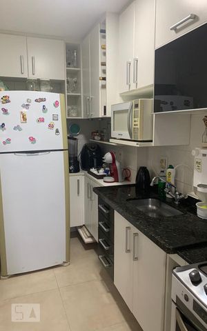 Apartamento à venda com 54m², 2 quartos e 1 vaga Apartamento à venda com 54m², 2 quartos e 1 vagaCozinha e Área de Serviço