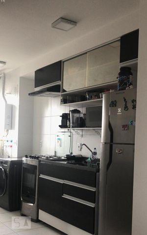 Apartamento à venda com 44m², 2 quartos e 1 vaga Apartamento à venda com 44m², 2 quartos e 1 vagaCozinha e Área de Serviço
