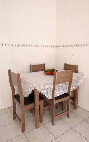 Casa à venda com 120m², 2 quartos e 2 vagas Casa à venda com 120m², 2 quartos e 2 vagasCozinha