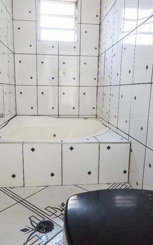 Casa à venda com 303m², 3 quartos e 2 vagasBanheiro da Suite