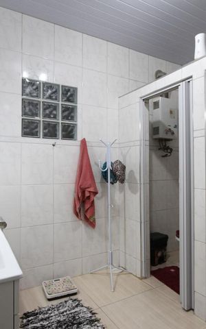 Casa à venda com 208m², 4 quartos e 2 vagasBanheiro