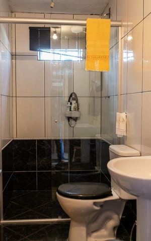 Casa à venda com 298m², 4 quartos e 2 vagasBanheiro Social