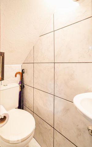 Casa à venda com 254m², 3 quartos e 3 vagas Casa à venda com 254m², 3 quartos e 3 vagasBanheiro da Garagem