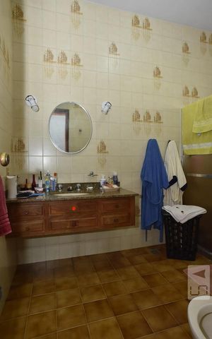 Casa de condomínio à venda com 450m², 4 quartos e 6 vagasBanheiro da Suíte 2