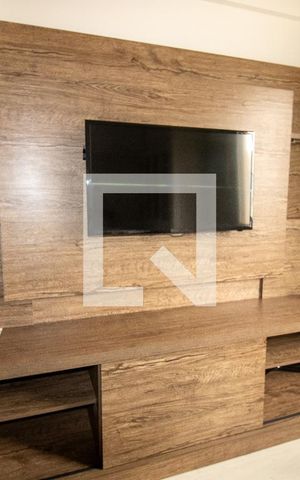 Apartamento à venda com 33m², 1 quarto e 1 vaga Apartamento à venda com 33m², 1 quarto e 1 vagaSala- detalhe rack e TV