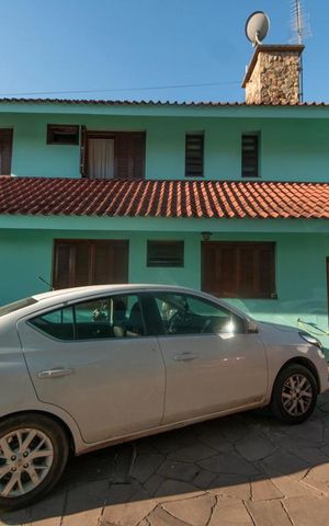 Casa à venda com 400m², 4 quartos e 4 vagasFachada Lateral