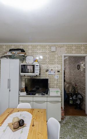 Casa à venda com 106m², 2 quartos e 2 vagas Casa à venda com 106m², 2 quartos e 2 vagasCozinha