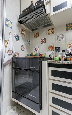Apartamento à venda com 130m², 2 quartos e 2 vagas Apartamento à venda com 130m², 2 quartos e 2 vagasFogão