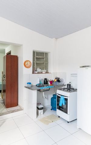 Casa à venda com 150m², 2 quartos e 2 vagas Casa à venda com 150m², 2 quartos e 2 vagasCozinha/Lavanderia da Edícula