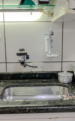 Casa de condomínio para alugar com 160m², 2 quartos e 1 vagaDeetalhe Cozinha