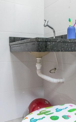 Casa de condomínio à venda com 60m², 2 quartos e 1 vagaBanheiro da Suíte 1
