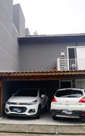 Casa de condomínio à venda com 70m², 2 quartos e 2 vagasFrente da Casa e Garagem