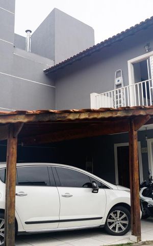 Casa de condomínio à venda com 70m², 2 quartos e 2 vagasFrente da Casa e Garagem